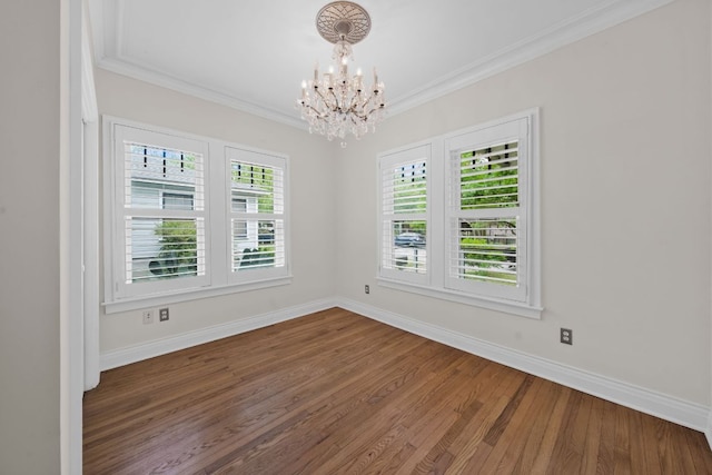 512 E 49th St, Austin, TX 78751 - unfurnished room with a chandelier, wood finished floors, and ornamental molding