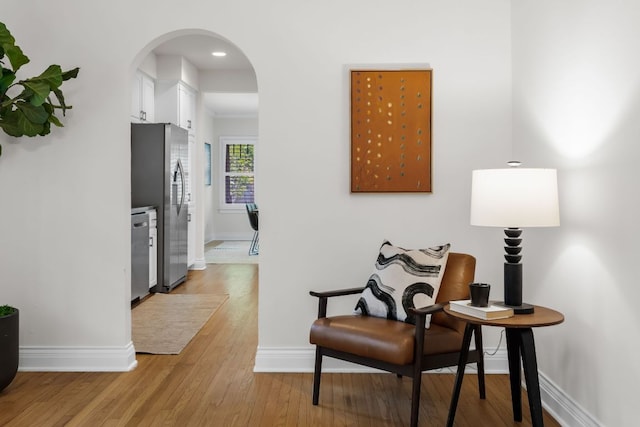 512 E 49th St, Austin, TX 78751 - sitting room featuring arched walkways and light wood-style flooring