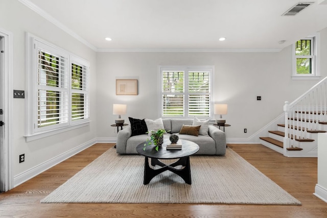 512 E 49th St, Austin, TX 78751 - living area with stairway, crown molding, wood finished floors, and recessed lighting