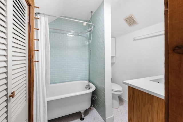 512 E 49th St, Austin, TX 78751 - bathroom with vanity, shower / bathtub combination with curtain, and tile patterned floors