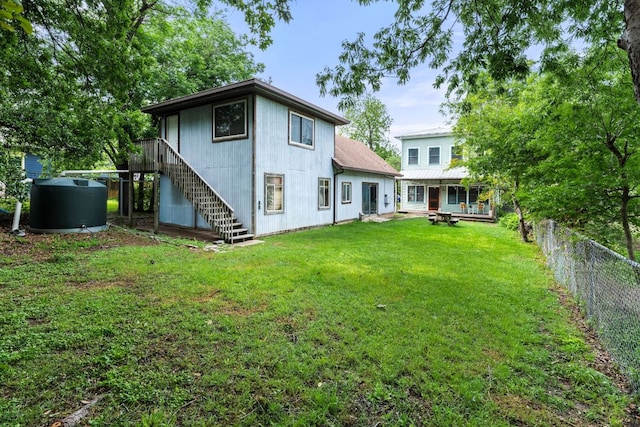 512 E 49th St, Austin, TX 78751 - rear view of house with stairs and a fenced backyard