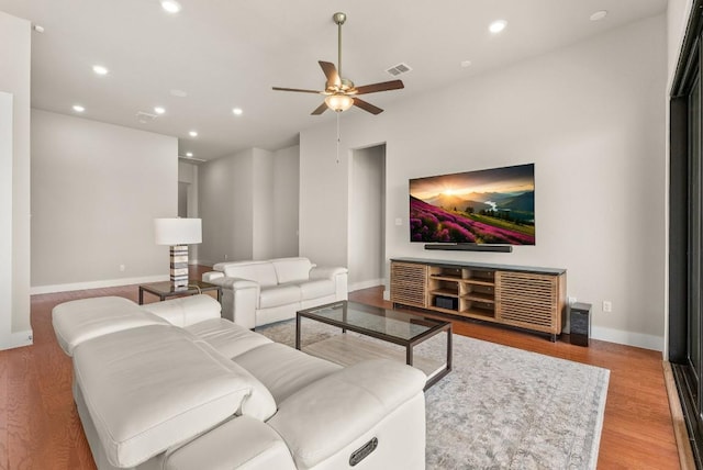 living room with ceiling fan, baseboards, wood finished floors, and recessed lighting