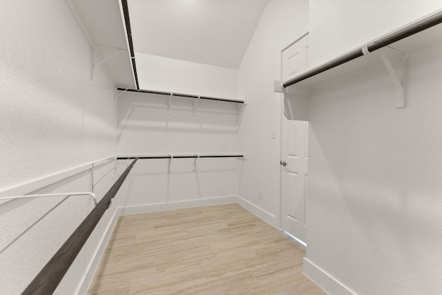 walk in closet featuring light wood finished floors