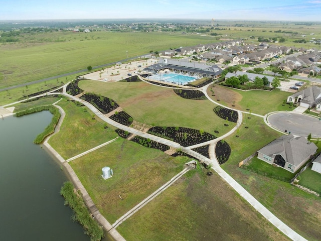 view of property location with a large body of water and a pool area