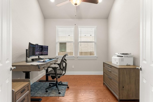 office with ceiling fan, light wood finished floors, and baseboards