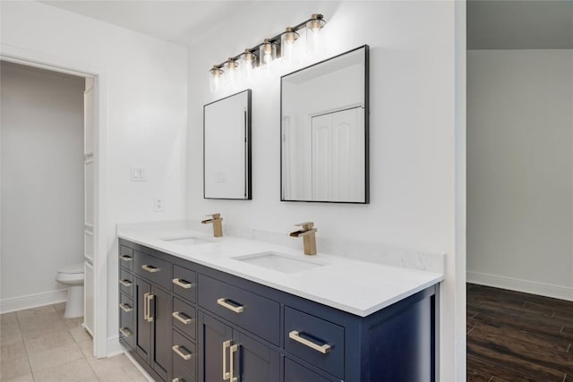 4703 Quicksilver Blvd, Austin, TX 78744 - full bathroom featuring double vanity and toilet
