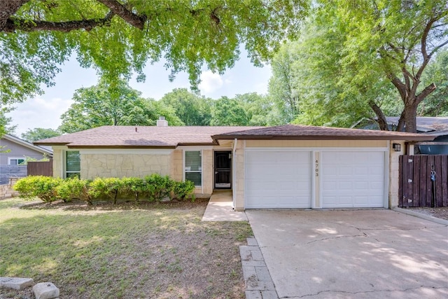 4703 Quicksilver Blvd, Austin, TX 78744 - ranch-style home featuring an attached garage, concrete driveway, a chimney, and a shingled roof