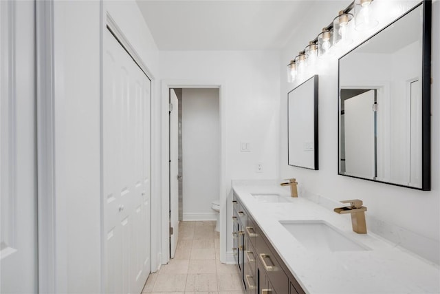 4703 Quicksilver Blvd, Austin, TX 78744 - bathroom featuring double vanity and a closet