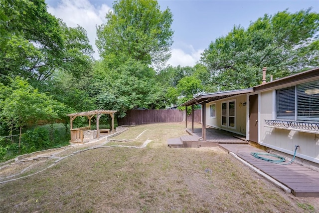 4703 Quicksilver Blvd, Austin, TX 78744 - view of yard with a pergola and a deck
