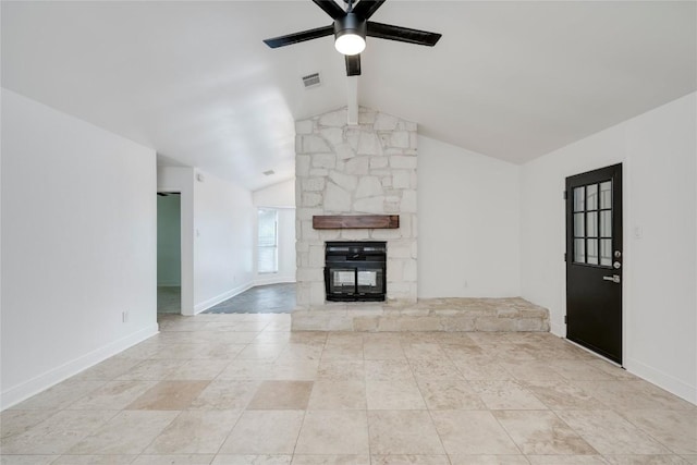 4703 Quicksilver Blvd, Austin, TX 78744 - unfurnished living room with ceiling fan, a stone fireplace, and tile patterned flooring