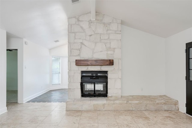 4703 Quicksilver Blvd, Austin, TX 78744 - unfurnished living room with tile patterned flooring and a stone fireplace
