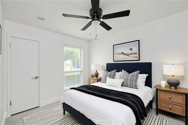 4703 Quicksilver Blvd, Austin, TX 78744 - bedroom with light tile patterned flooring and a ceiling fan
