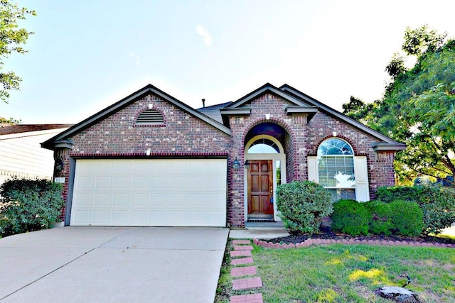 11120 Old Quarry Rd, Austin, TX 78717 - view of front of home with brick siding, concrete driveway, and a garage