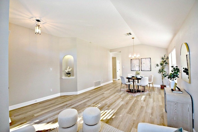 11120 Old Quarry Rd, Austin, TX 78717 - living area with a chandelier, vaulted ceiling, light wood-style flooring, and baseboards