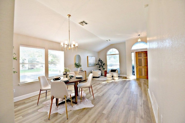 11120 Old Quarry Rd, Austin, TX 78717 - dining area with plenty of natural light, light wood-style floors, a chandelier, baseboards, and lofted ceiling