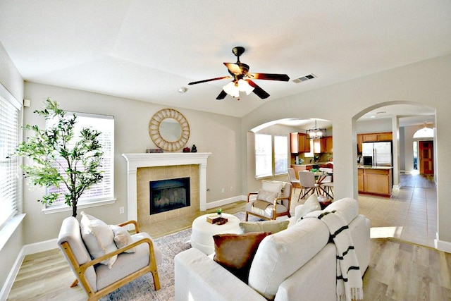 11120 Old Quarry Rd, Austin, TX 78717 - living area featuring arched walkways, healthy amount of natural light, and a ceiling fan