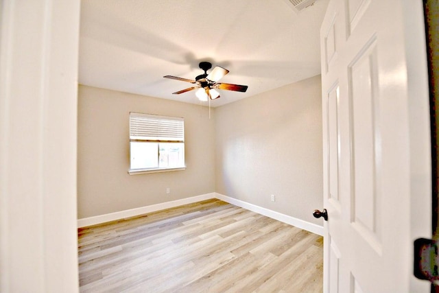 11120 Old Quarry Rd, Austin, TX 78717 - spare room with ceiling fan, light wood-type flooring, and baseboards