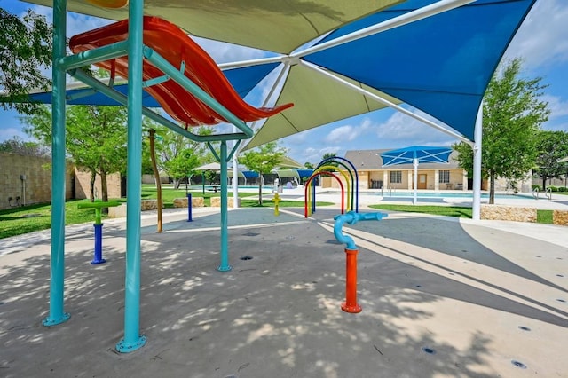 view of property's community featuring fence and a swimming pool