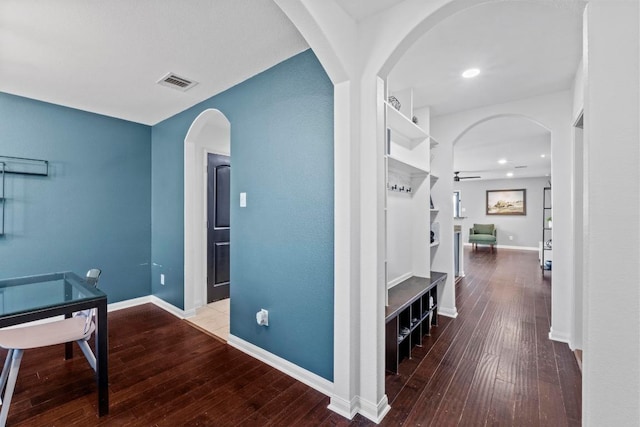 hallway featuring hardwood / wood-style flooring, baseboards, and recessed lighting