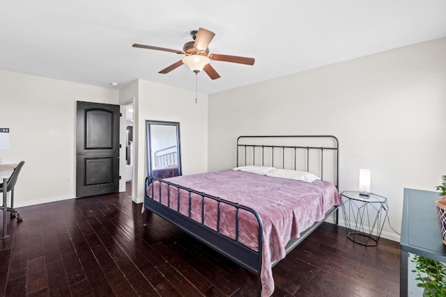 bedroom with hardwood / wood-style flooring, baseboards, and ceiling fan