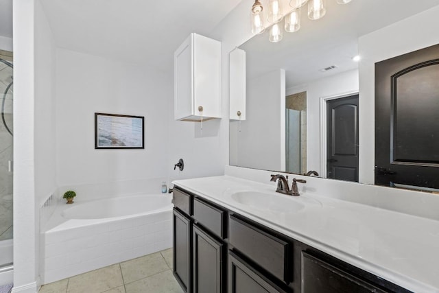 bathroom featuring a shower stall, a bath, vanity, and tile patterned flooring