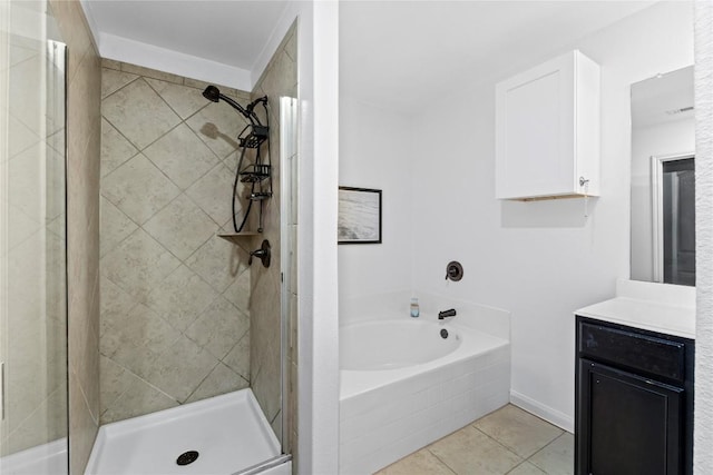full bath with a stall shower, tile patterned flooring, vanity, and a garden tub