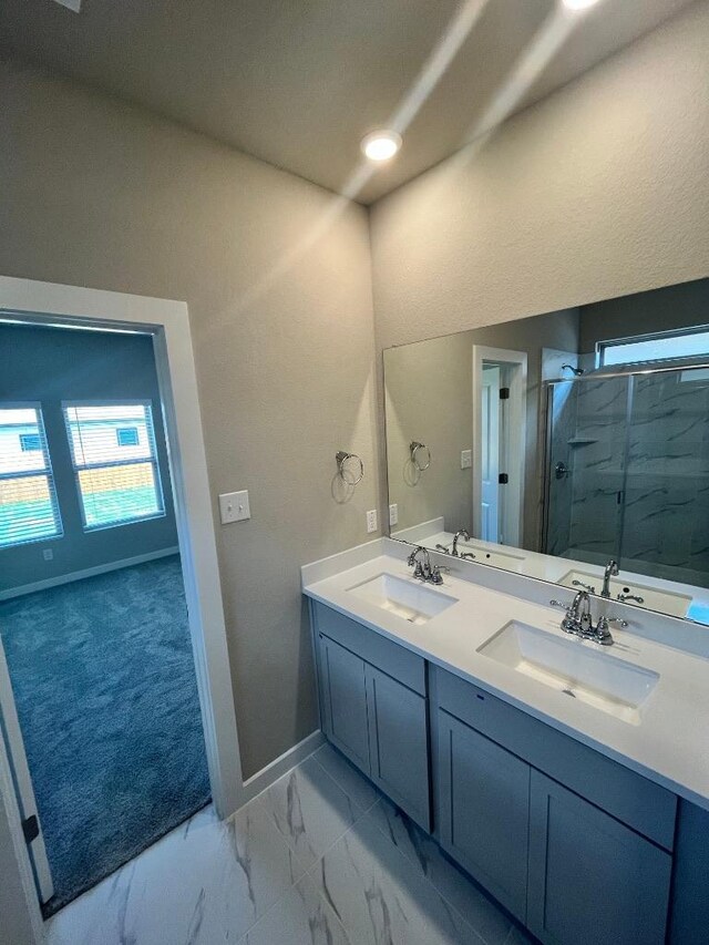 264 Little Green Trl, Jarrell, TX 76537 - full bath with a marble finish shower, double vanity, plenty of natural light, and marble finish floors
