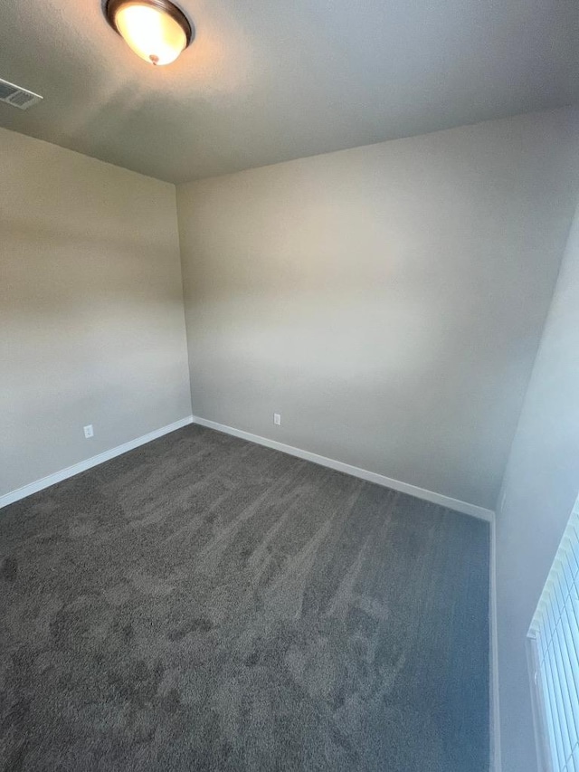 264 Little Green Trl, Jarrell, TX 76537 - empty room with baseboards and dark carpet