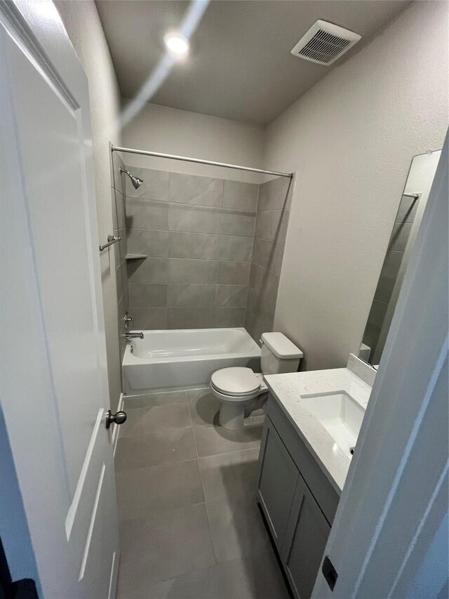 264 Little Green Trl, Jarrell, TX 76537 - full bathroom featuring vanity, washtub / shower combination, and tile patterned flooring