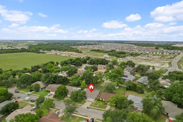 aerial overview of property's location with nearby suburban area