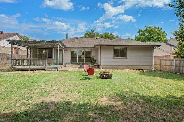 back of property with a pergola, an outdoor fire pit, a deck, and a patio area