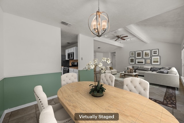 tiled dining room featuring a ceiling fan, a chandelier, and baseboards