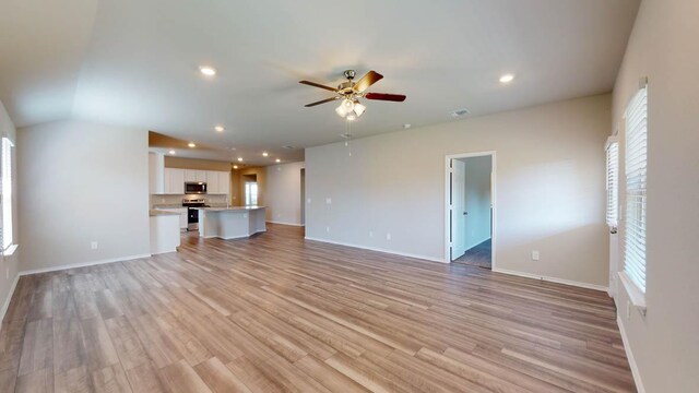 2402 Bee Creek Dr, Copperas Cove, TX 76522 - unfurnished living room with a ceiling fan, light wood finished floors, baseboards, and recessed lighting