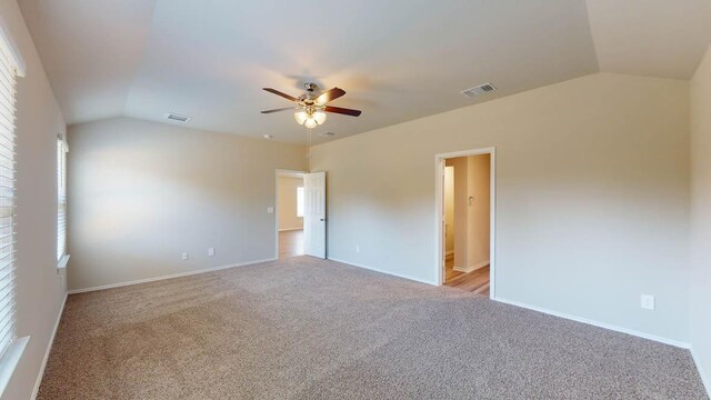 2402 Bee Creek Dr, Copperas Cove, TX 76522 - spare room featuring lofted ceiling, a ceiling fan, light carpet, and baseboards