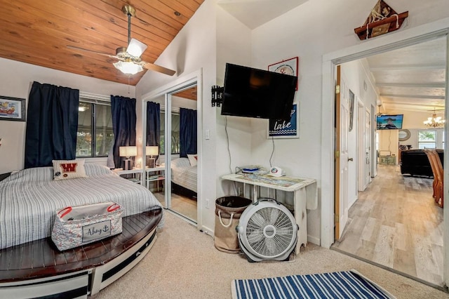 bedroom with vaulted ceiling, a chandelier, a closet, wood ceiling, and baseboards