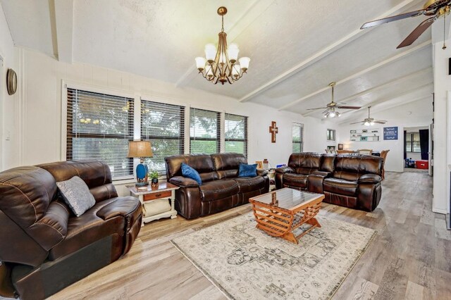 living room featuring ceiling fan, a chandelier, and light wood-style floors