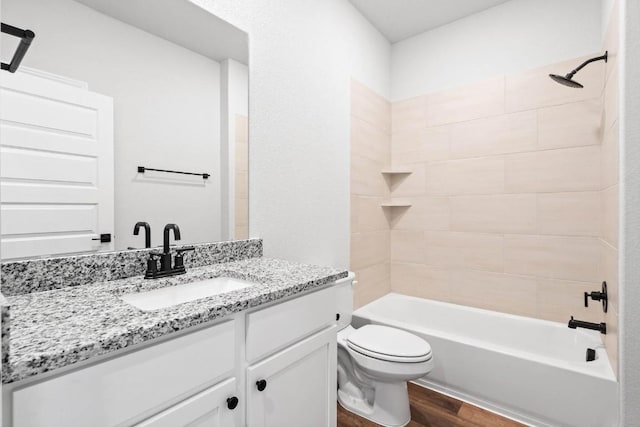 9321 Gladsome Path, Manor, TX 78653 - bathroom with wood finished floors, vanity, toilet, and shower / bathtub combination