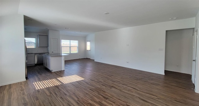 5605 Bellissima Way, Round Rock, TX 78665 - unfurnished living room with dark wood finished floors and baseboards