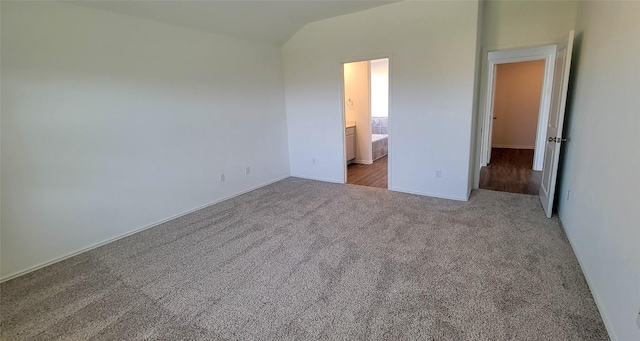5605 Bellissima Way, Round Rock, TX 78665 - unfurnished bedroom with carpet flooring, vaulted ceiling, baseboards, and connected bathroom