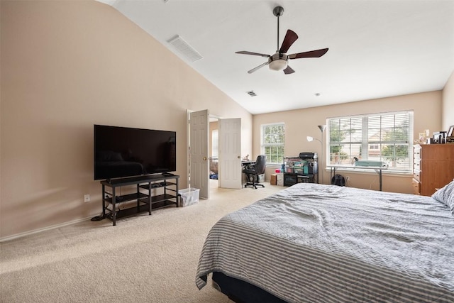 carpeted bedroom featuring lofted ceiling, a ceiling fan, an office area, and baseboards