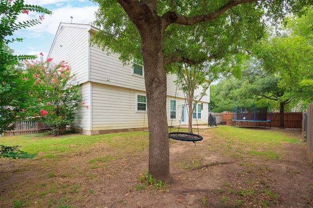view of yard with a trampoline