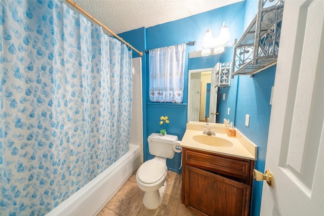 bathroom with toilet, vanity, shower / tub combo, a textured ceiling, and baseboards