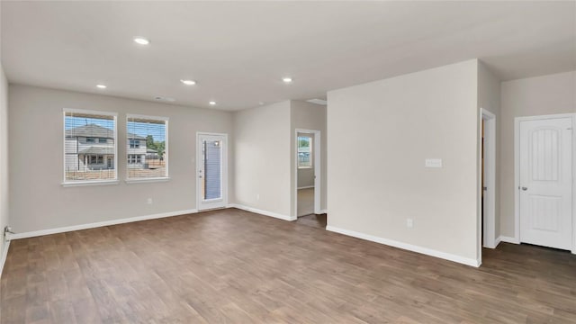 204 Inks Ln, Kyle, TX 78640 - empty room featuring wood finished floors, baseboards, and recessed lighting