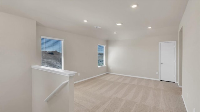 204 Inks Ln, Kyle, TX 78640 - unfurnished room featuring light colored carpet, baseboards, and recessed lighting