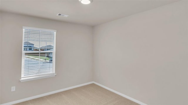 204 Inks Ln, Kyle, TX 78640 - unfurnished room with baseboards, plenty of natural light, and light carpet