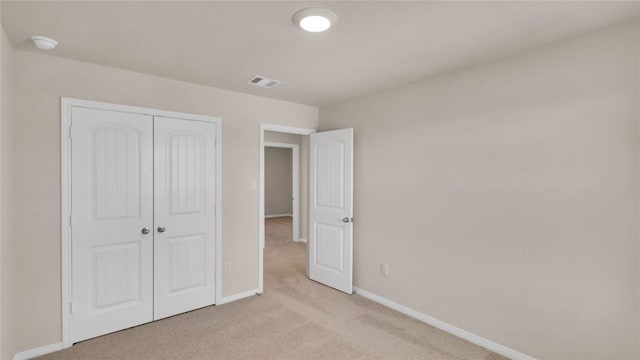 204 Inks Ln, Kyle, TX 78640 - unfurnished bedroom with light colored carpet, baseboards, and a closet