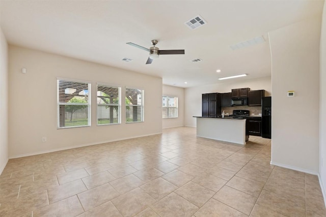 3548 Pauling Loop, Round Rock, TX 78665 - unfurnished living room with light tile patterned floors and a ceiling fan