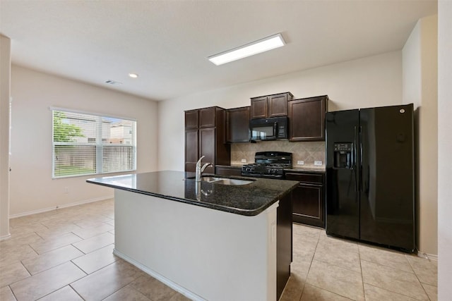 kitchen featuring black appliances, a sink, tasteful backsplash, dark brown cabinets, and light tile patterned floors