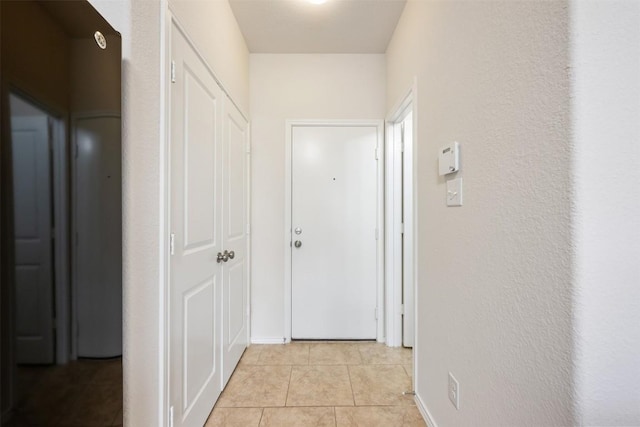 corridor with light tile patterned floors