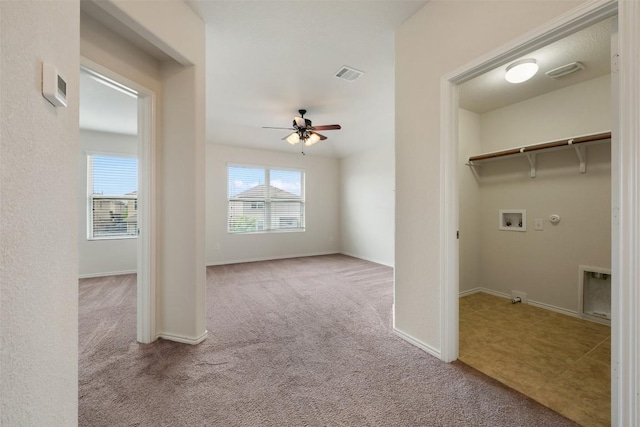 laundry area featuring hookup for a gas dryer, washer hookup, carpet flooring, ceiling fan, and baseboards